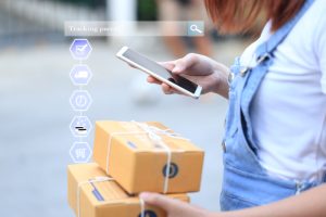 Online shopping, Woman hand holding smart phone and tracking par